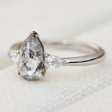 elongated pear shape salt and pepper diamond trilogy platinum engagement ring