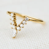 elongated v shaped diamond wedding band in yellow gold