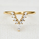 elongated v shaped diamond wedding band in yellow gold