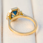 emerald cut blue sapphire one of a kind engagement ring in yellow gold