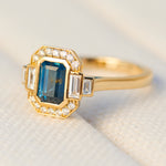 emerald cut blue sapphire one of a kind engagement ring in yellow gold