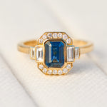 emerald cut blue sapphire one of a kind engagement ring in yellow gold