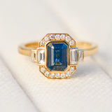 emerald cut blue sapphire one of a kind engagement ring in yellow gold