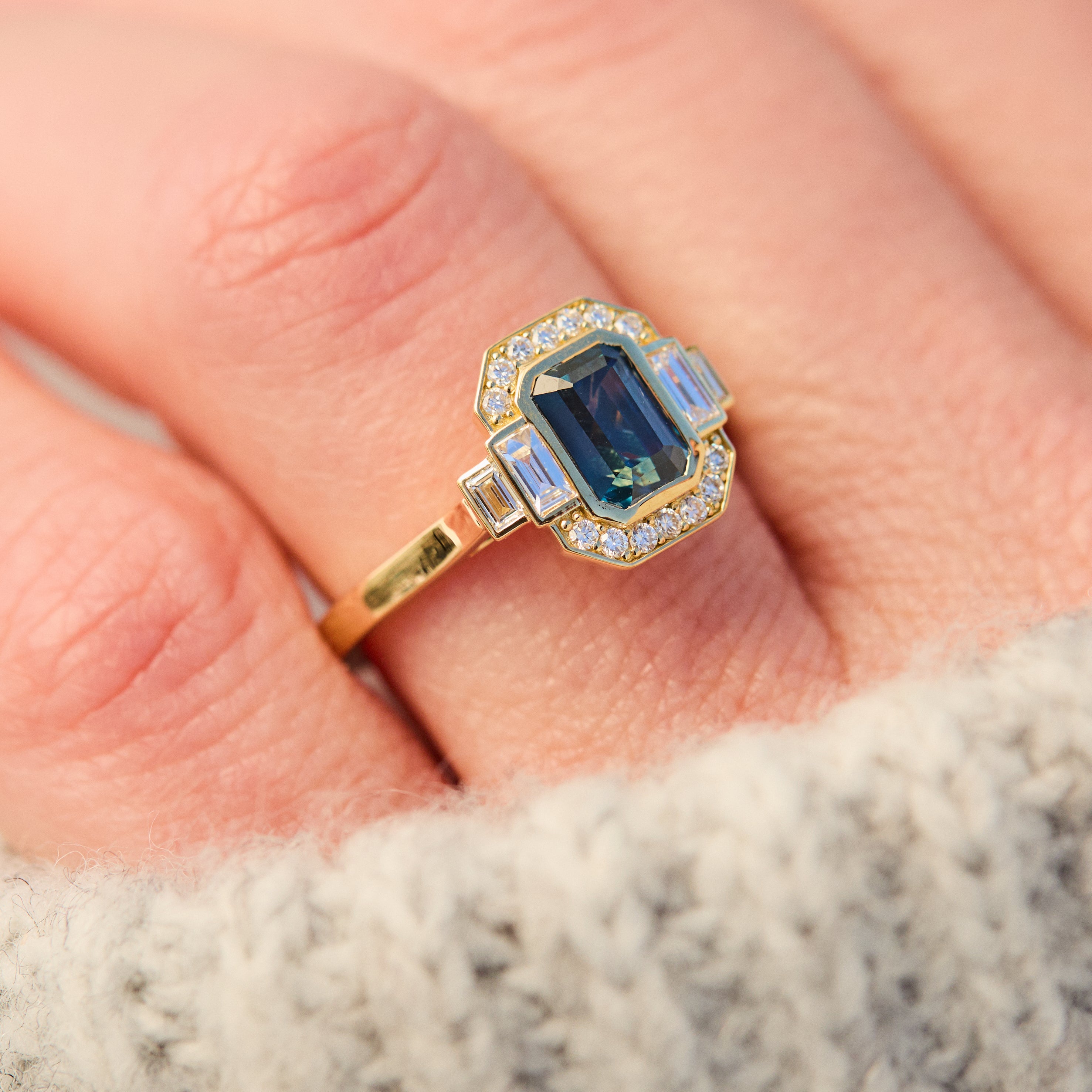 emerald cut blue sapphire one of a kind engagement ring in yellow gold