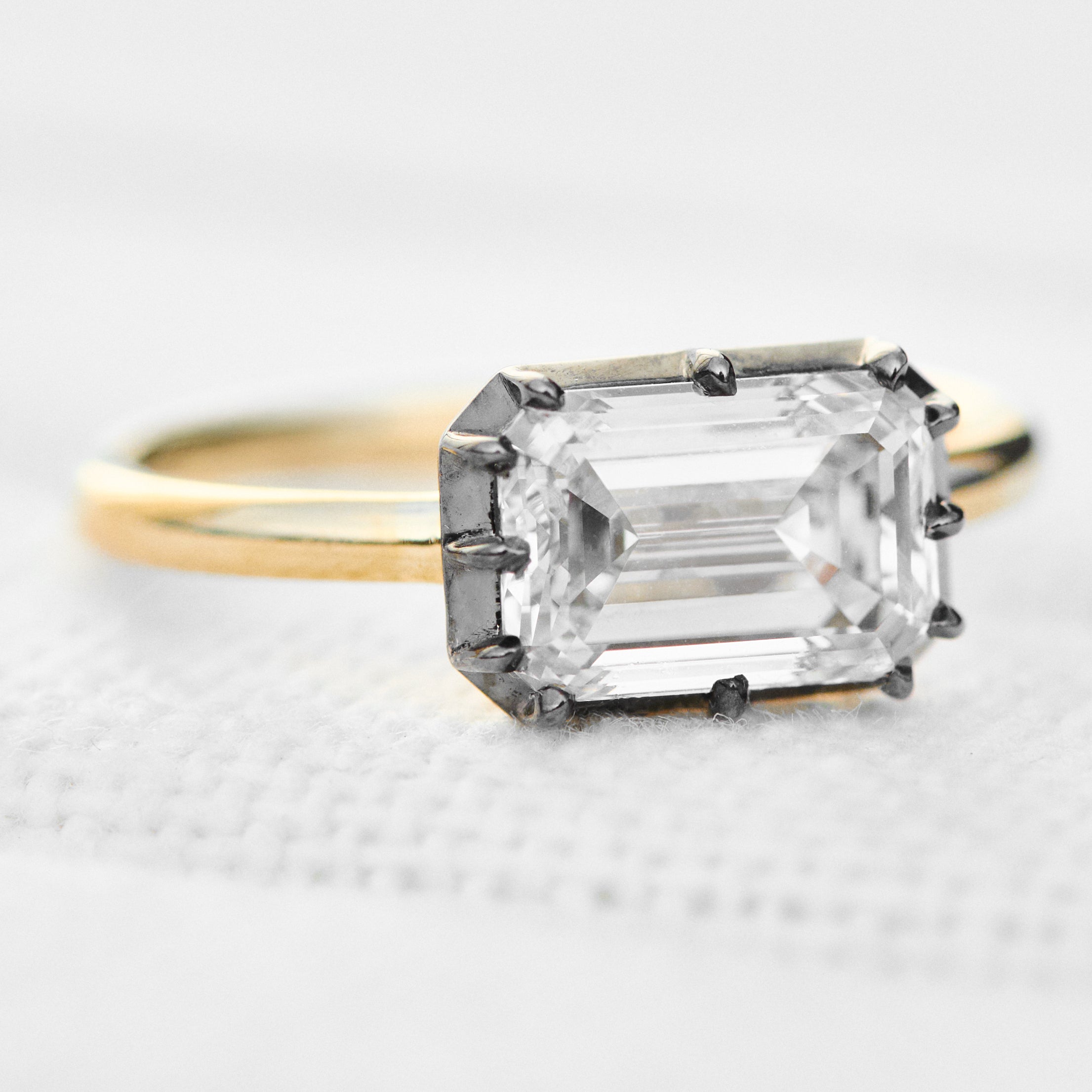 emerald cut lab grown diamond engagement ring east west setting