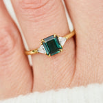 18ct yellow gold emerald cut trilogy ​teal sapphire rings