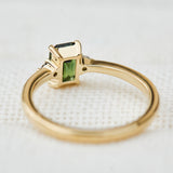 emerald cut green sapphire ring in yellow gold