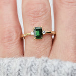 emerald cut green sapphire ring in yellow gold