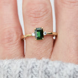 emerald cut green sapphire ring in yellow gold