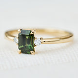 emerald cut green sapphire ring in yellow gold