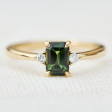 emerald cut green sapphire ring in yellow gold