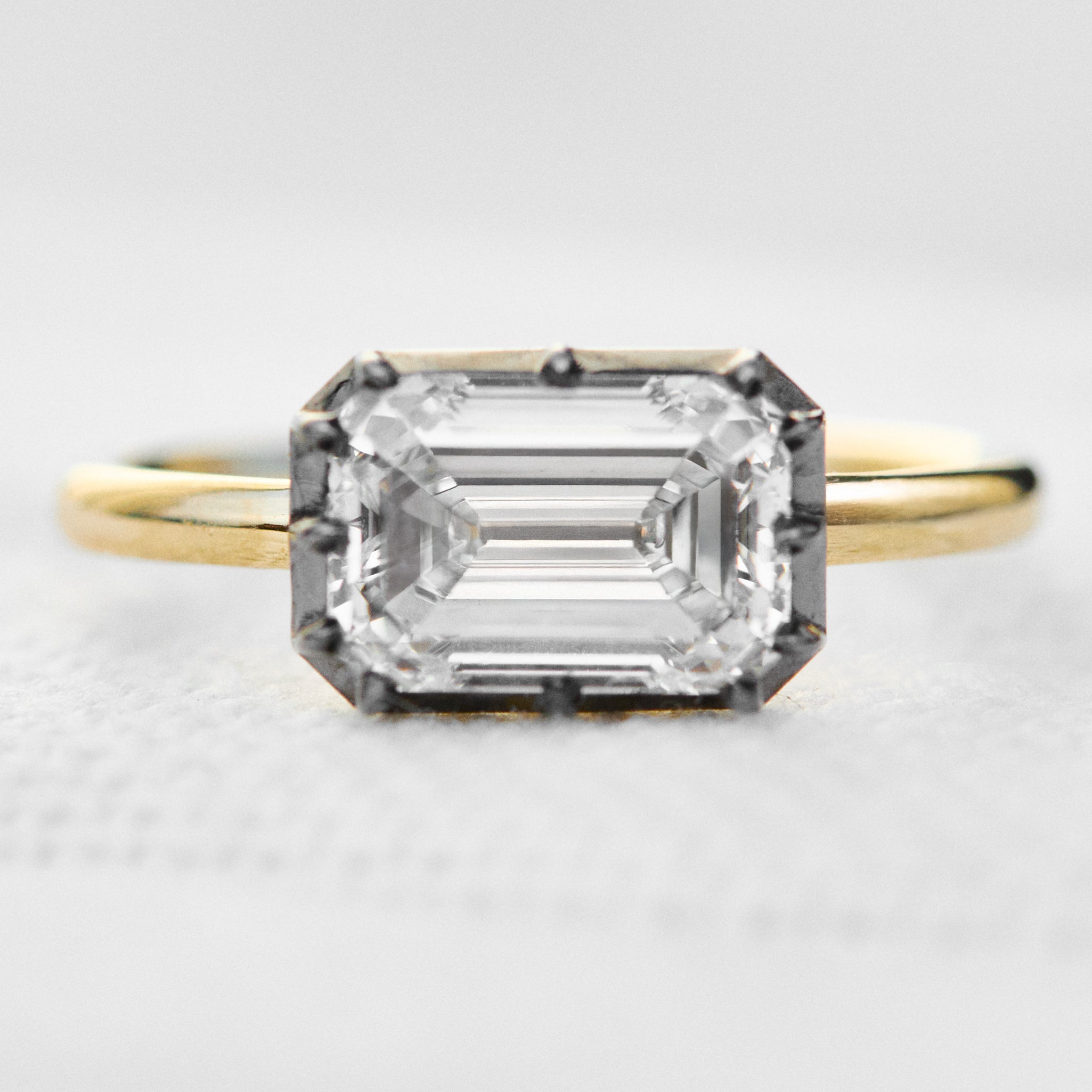 emerald cut lab grown diamond engagement ring east west setting