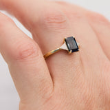 emerald cut sapphire trilogy engagement ring in yellow gold
