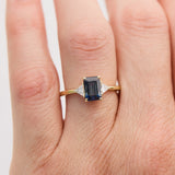 emerald cut sapphire trilogy engagement ring in yellow gold