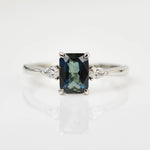 emerald cut teal blue sapphire engagement ring