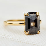 emerald shape black diamond solitaire ring