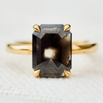 emerald shape black diamond solitaire ring