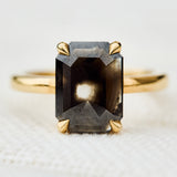emerald shape black diamond solitaire ring
