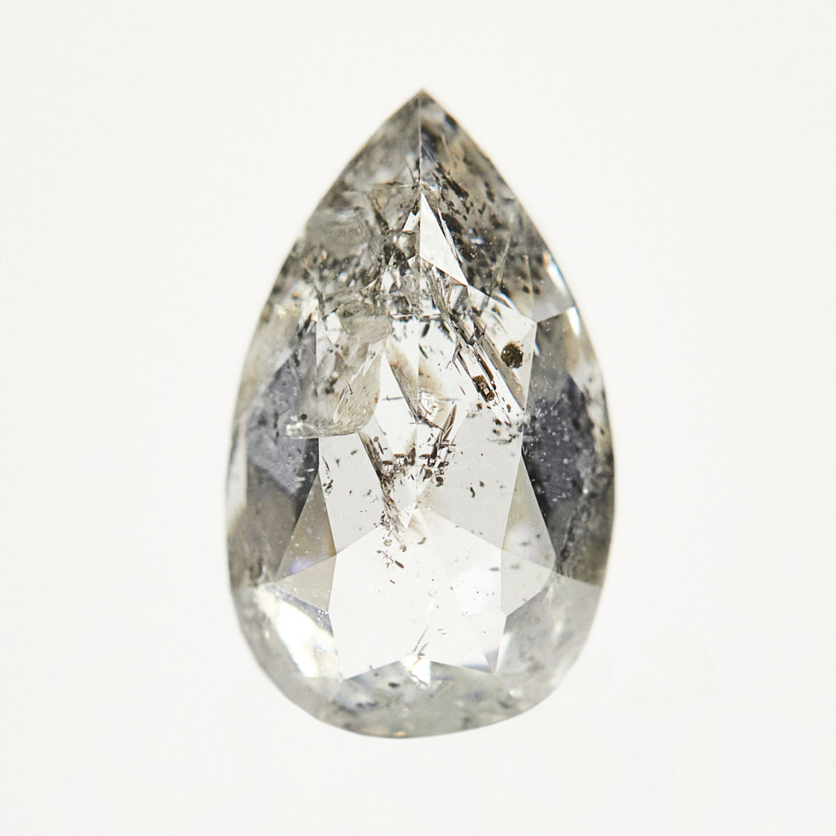 Timeless pear-shaped rose-cut ethically sourced salt and pepper diamond.