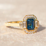 emerald cut blue sapphire one of a kind engagement ring in yellow gold