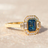 emerald cut blue sapphire one of a kind engagement ring in yellow gold