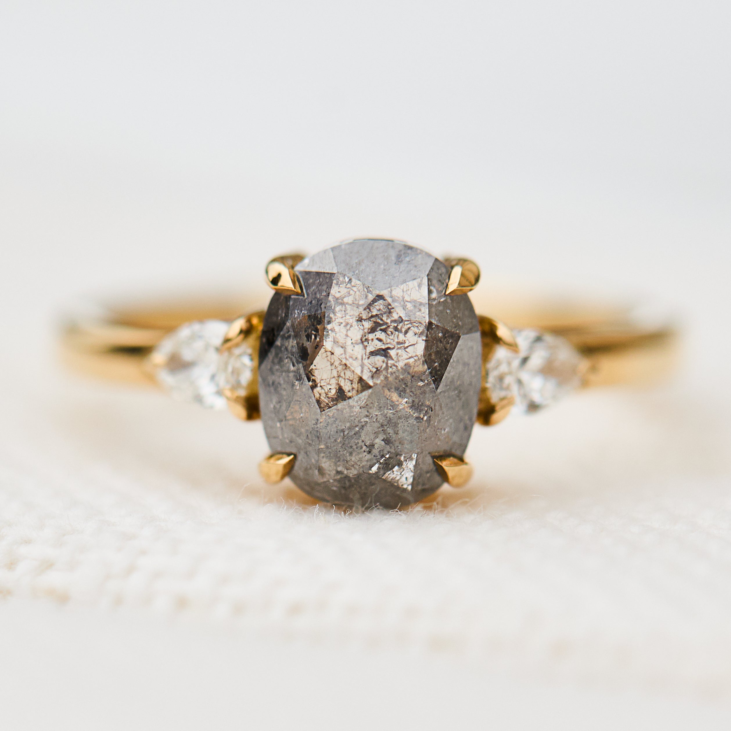 grey salt and pepper oval diamond trilogy engagement ring