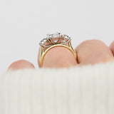 elongated cushion lab grown diamond trilogy engagement ring in yellow gold