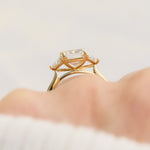 emerald cut lab grown diamond trilogy engagement ring set in yellow gold