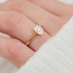 oval lab grown diamond engagement ring in yellow gold