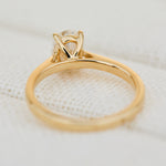 oval lab grown diamond engagement ring in yellow gold