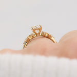 oval lab grown diamond engagement ring set in timeless yellow gold