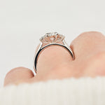 oval lab grown diamond ring in platinum paired with six round brilliant side diamonds