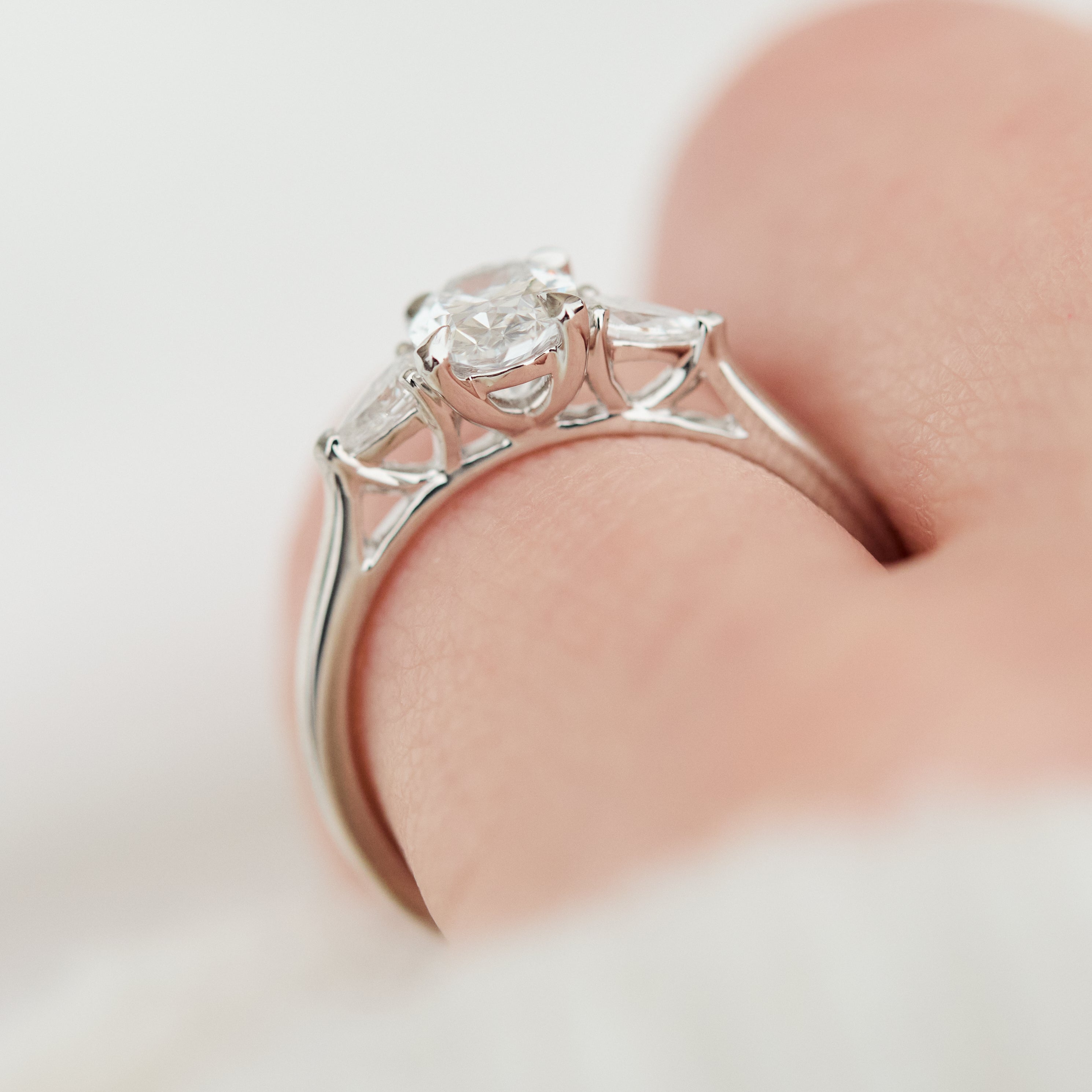 oval lab grown diamond trilogy engagement ring in platinum