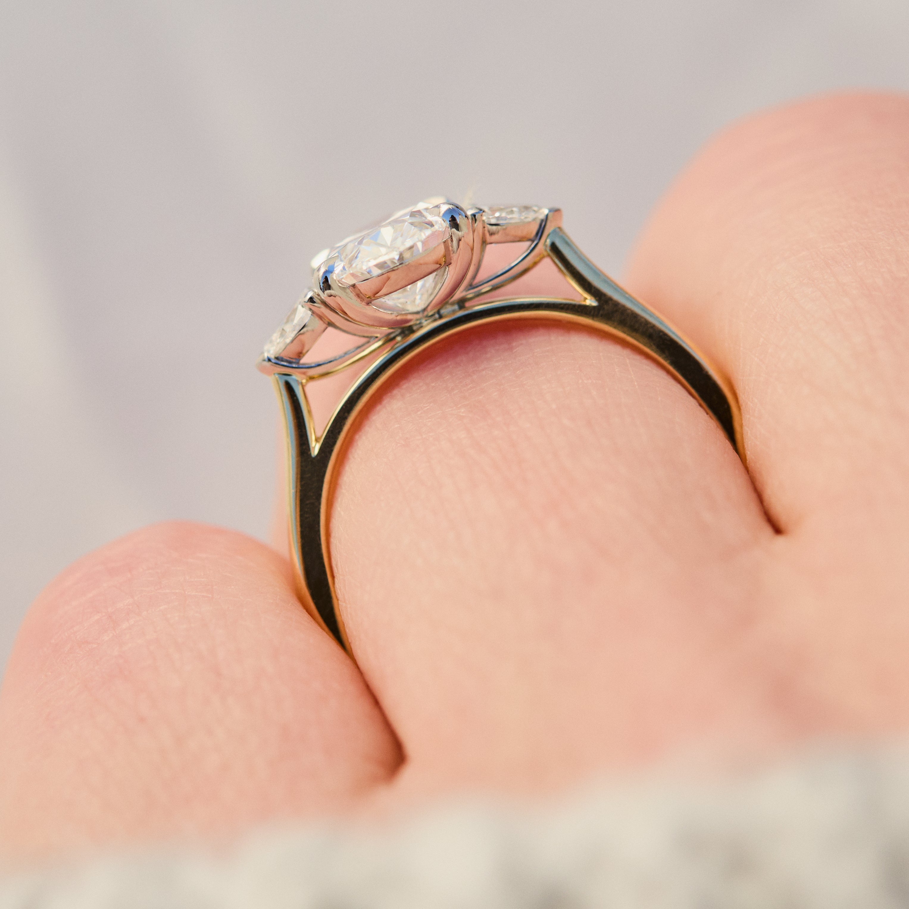 oval lab grown diamond yellow gold and platinum engagement ring