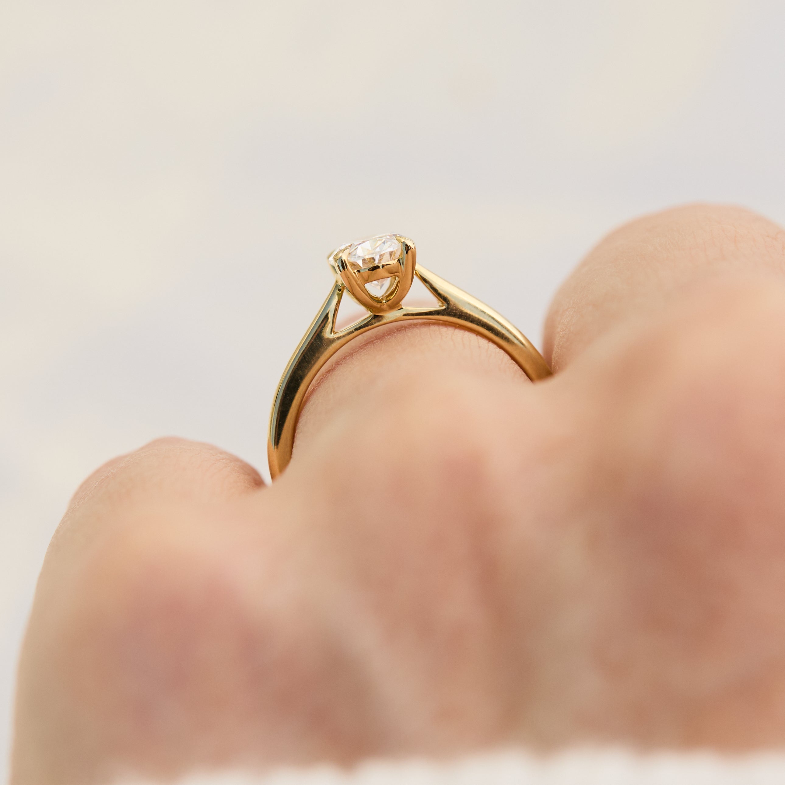 oval lab grown diamond yellow gold engagement ring