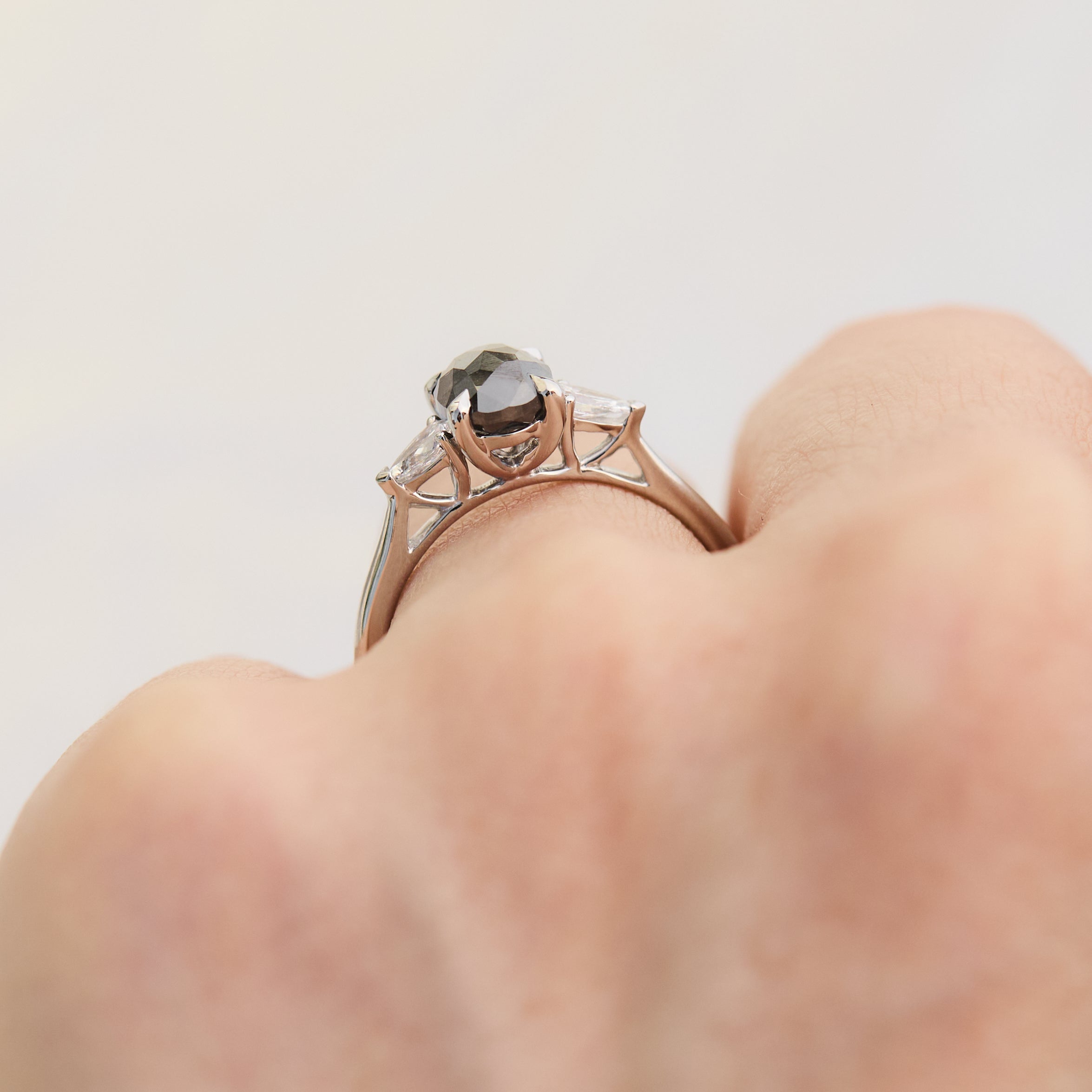 oval rose cut salt and pepper diamond trilogy engagement ring in platinum