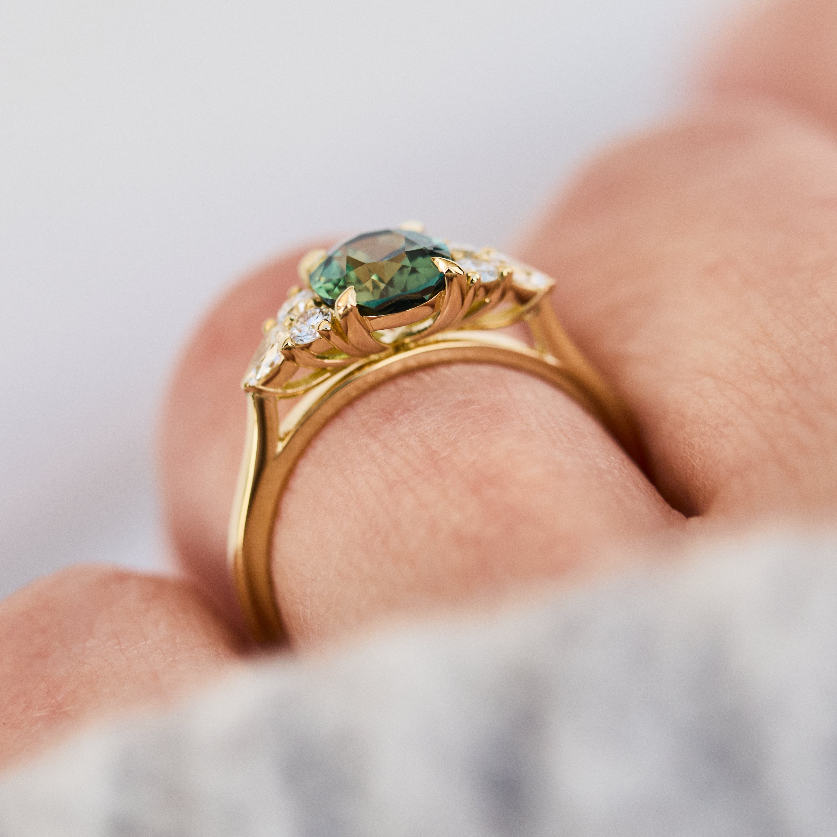 oval unheated green teal sapphire engagement ring in yellow gold