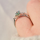 platinum oval teal sapphire engagement trilogy ring