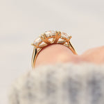 round brilliant cut lab grown diamond yellow gold trilogy engagement ring