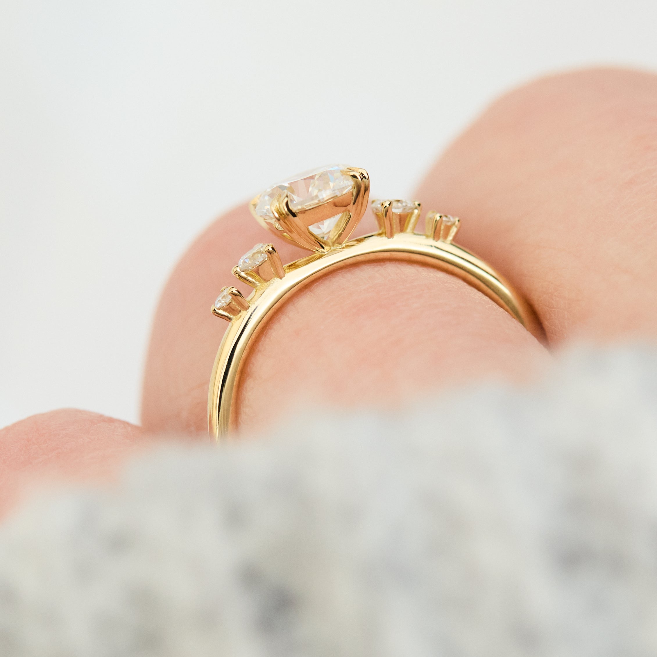 round brilliant five diamond engagement ring in yellow gold