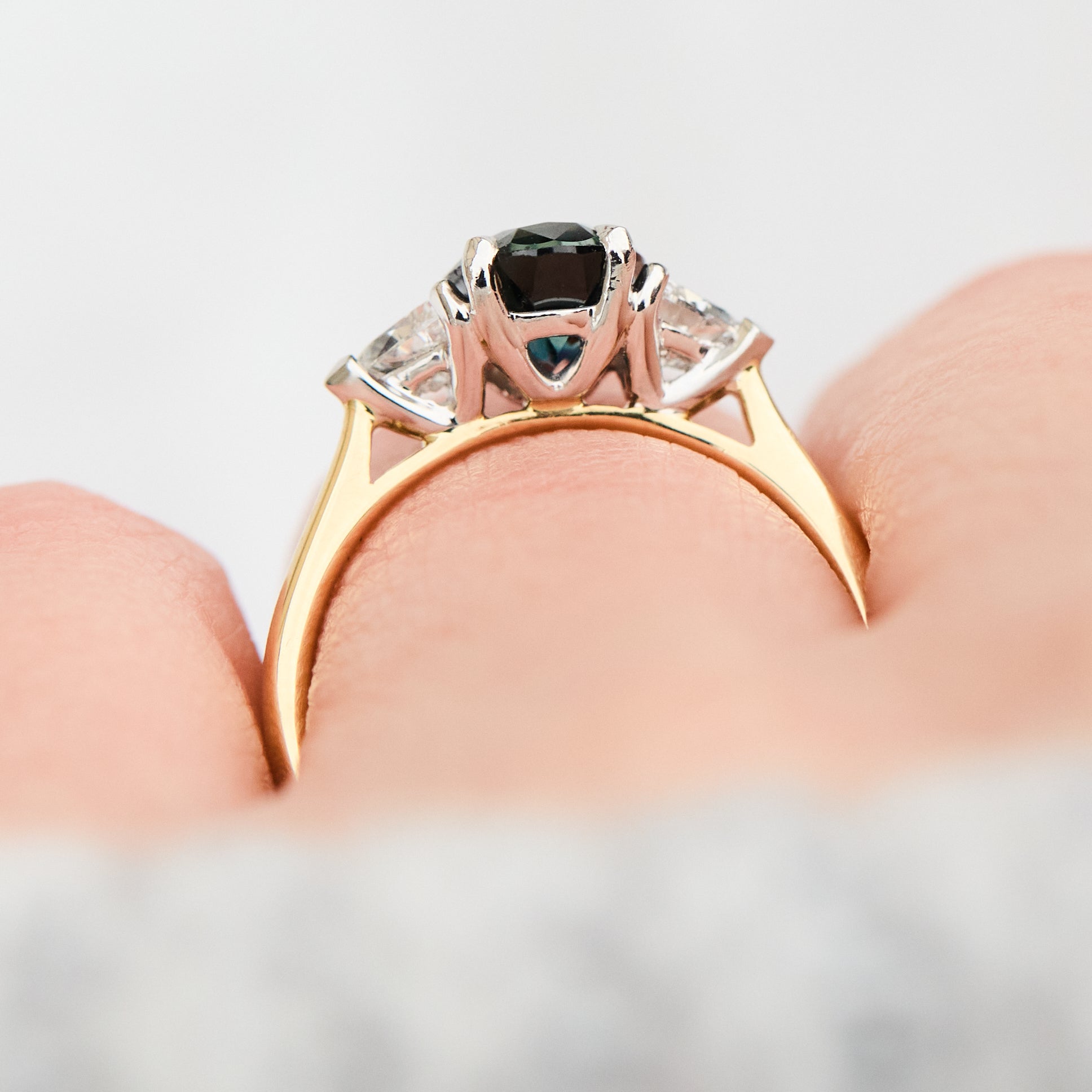 teal blue oval sapphire yellow gold and platinum engagement ring