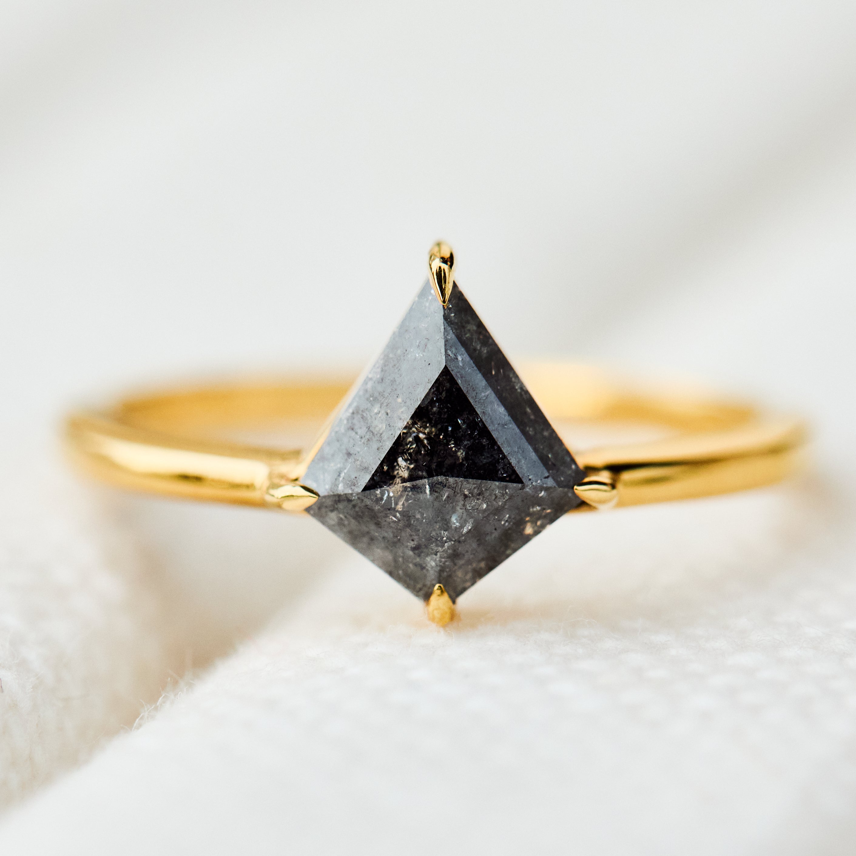 kite shape dark salt and pepper diamond solitaire engagement ring in yellow gold