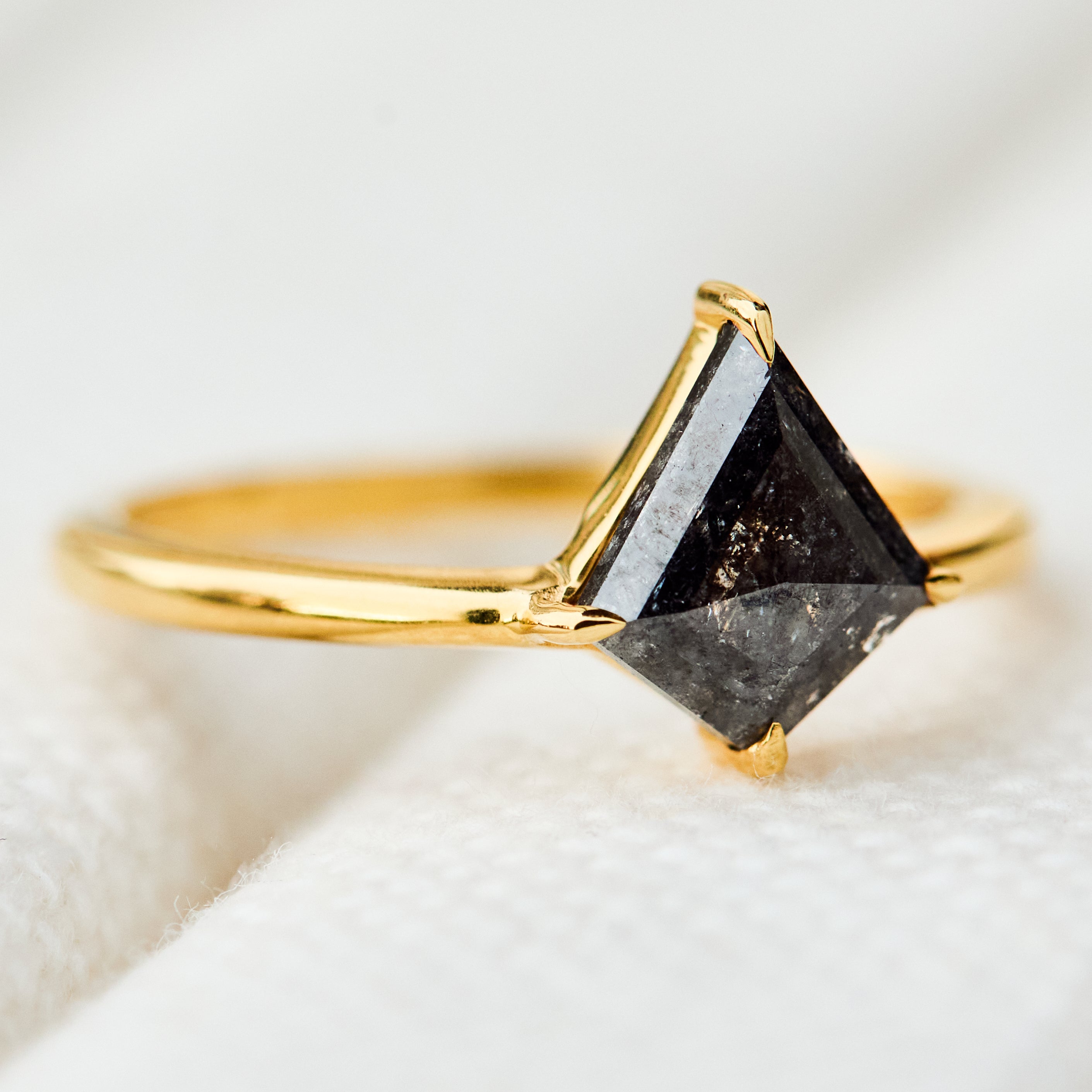 kite shape dark salt and pepper diamond solitaire engagement ring in yellow gold