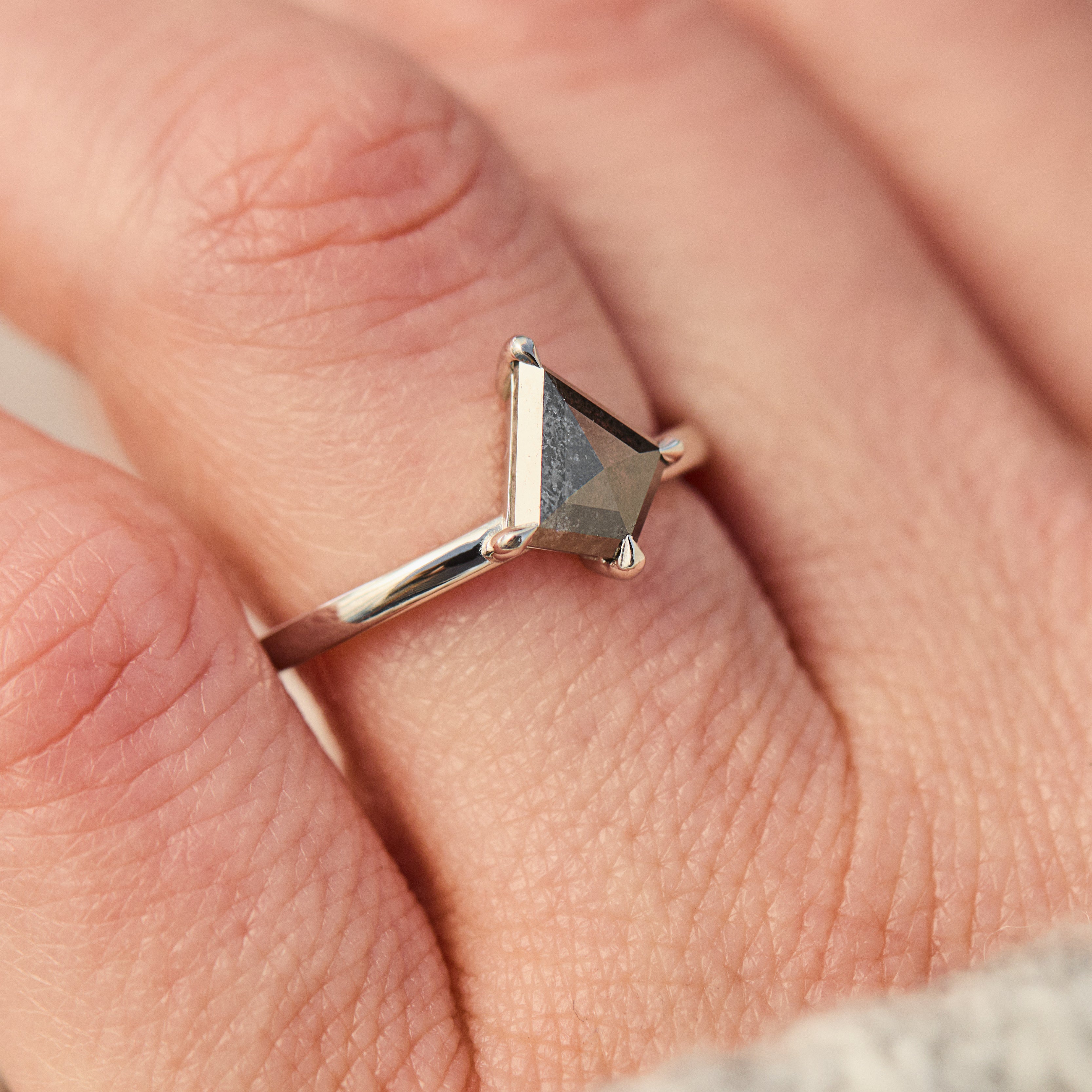 kite shape salt and pepper solitaire engagement ring in platinum