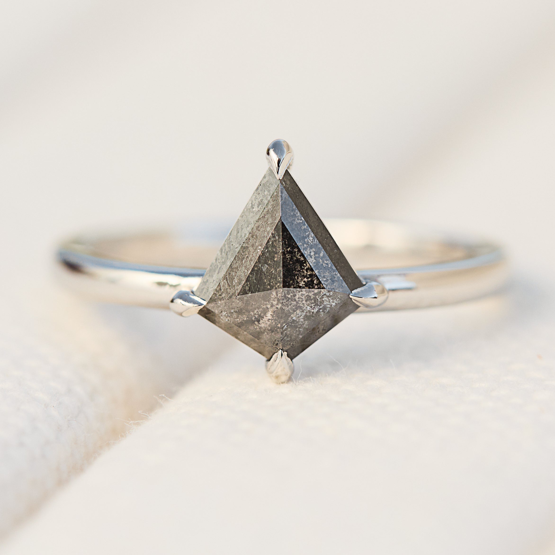 kite shape salt and pepper solitaire engagement ring in platinum