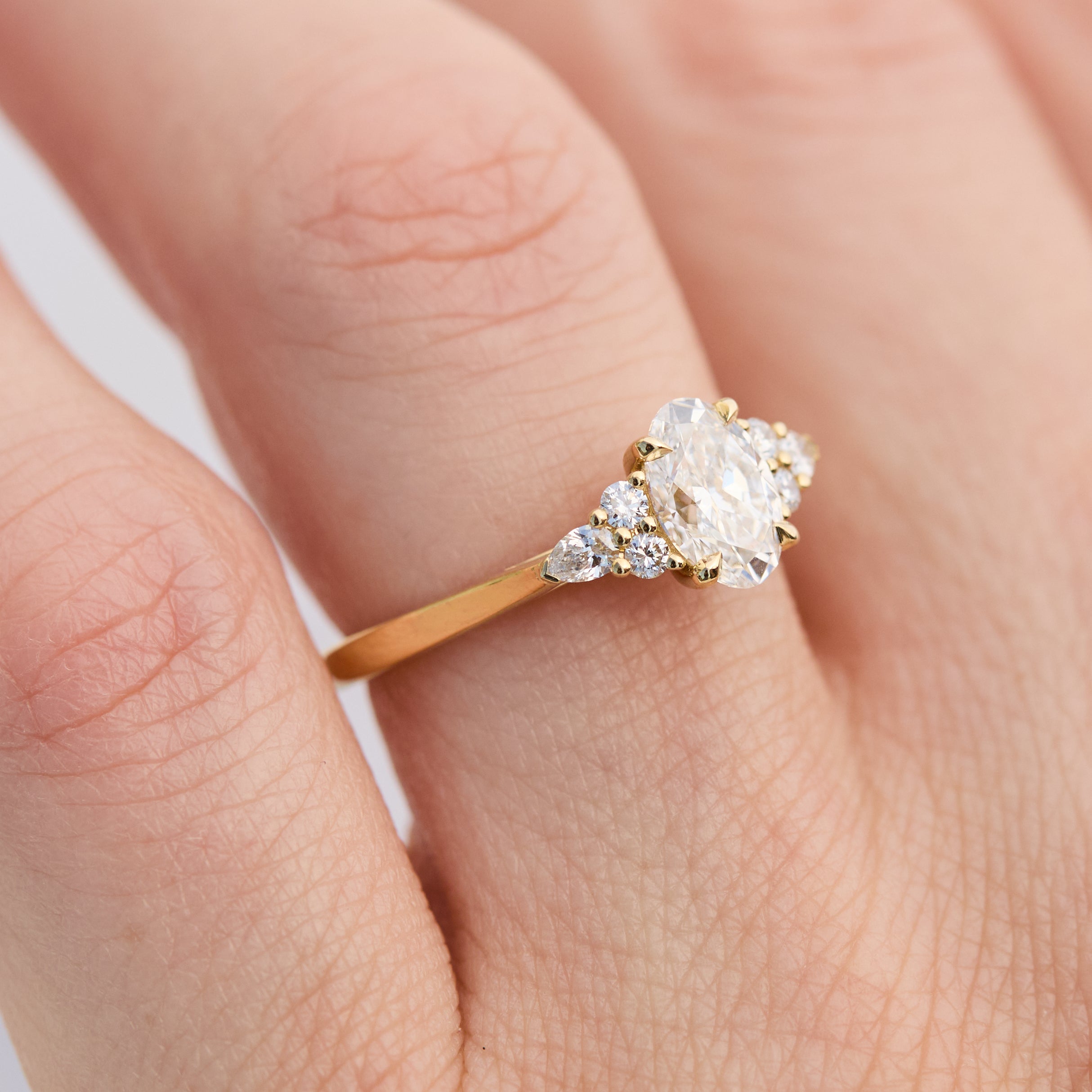 oval lab grown diamond engagement ring set in 18ct yellow gold
