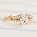 oval lab grown diamond engagement ring set in timeless yellow gold
