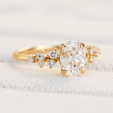 oval lab grown diamond engagement ring set in timeless yellow gold
