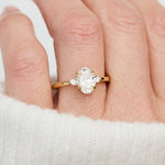 oval lab grown diamond yellow gold trilogy engagement ring