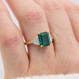 lab grown emerald and diamonds engagement ring set in yellow gold
